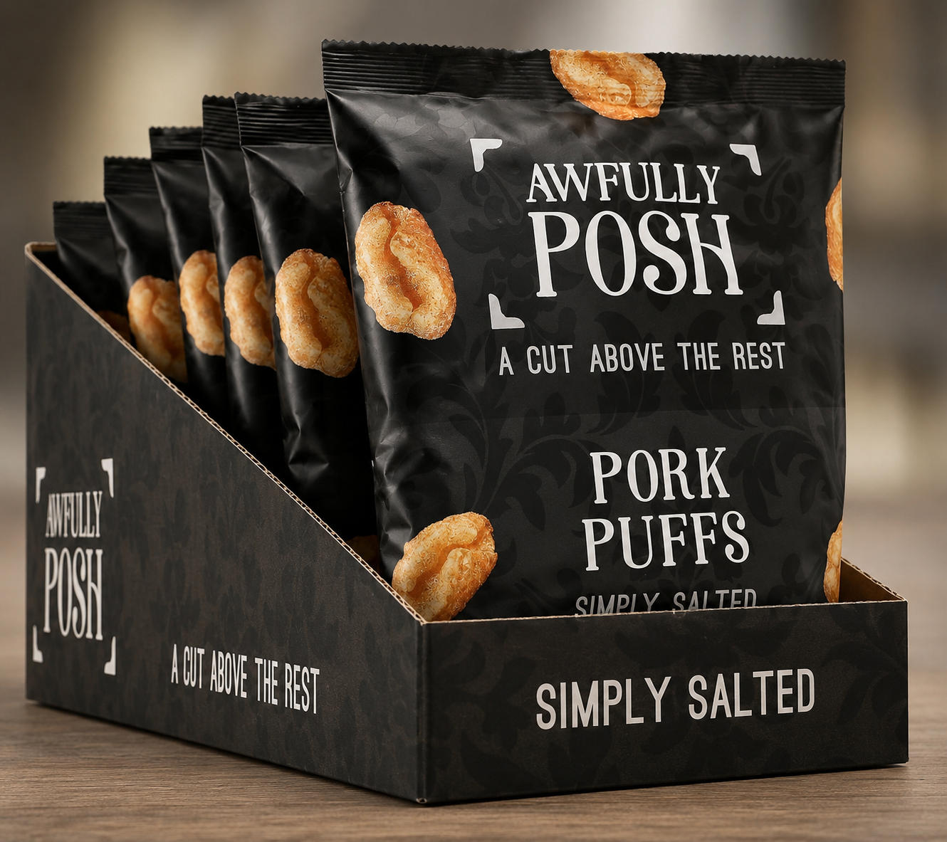 Awfully Posh Pork Puffs self-merchandising case - five sharing packs in a printed black retail tray with the AP brackets and 'A Cut Above The Rest' tagline